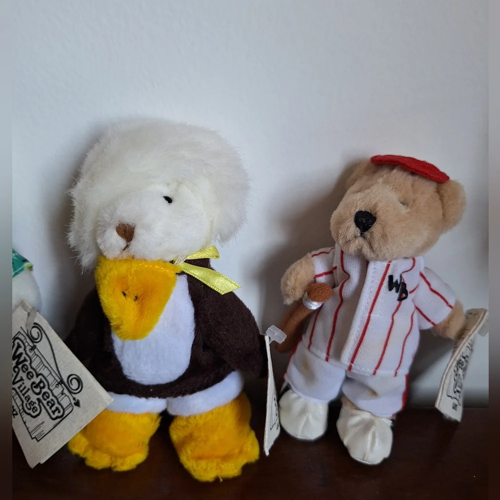 Collectible teddy bears from the Ganz brand, specifically from the Wee Bear Vill